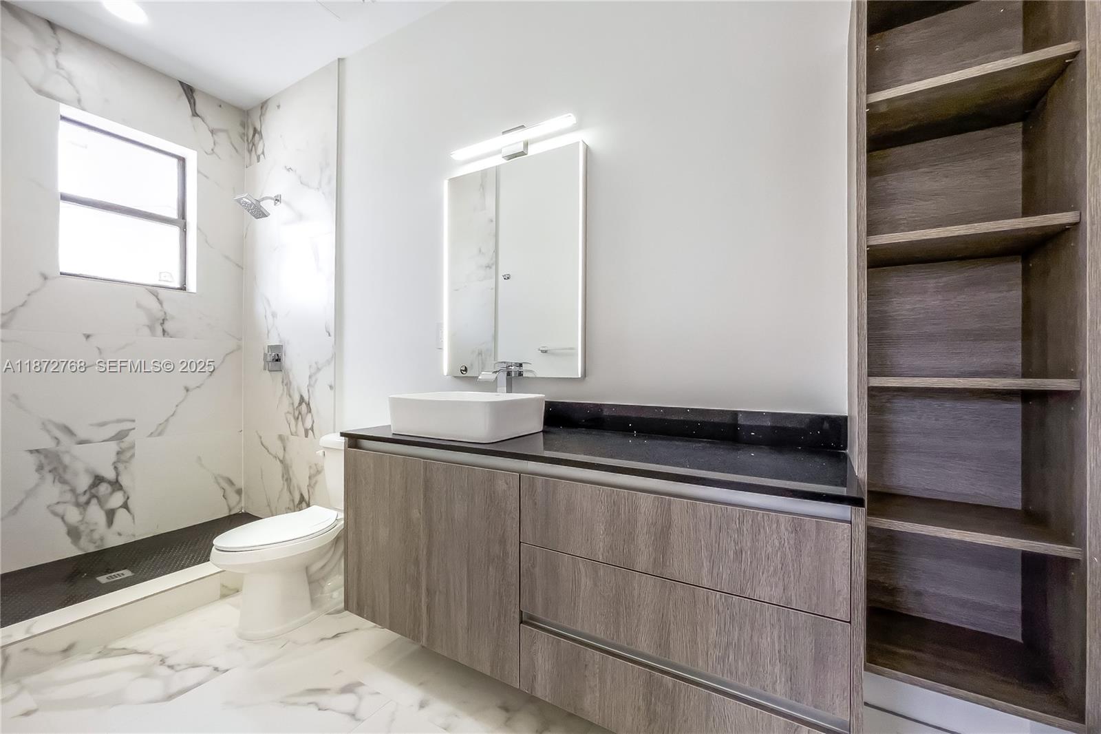 6159 Southwest 36th Court Miramar, FL 33023 - Photo 26 of 28 a bathroom with a sink a toilet and shower