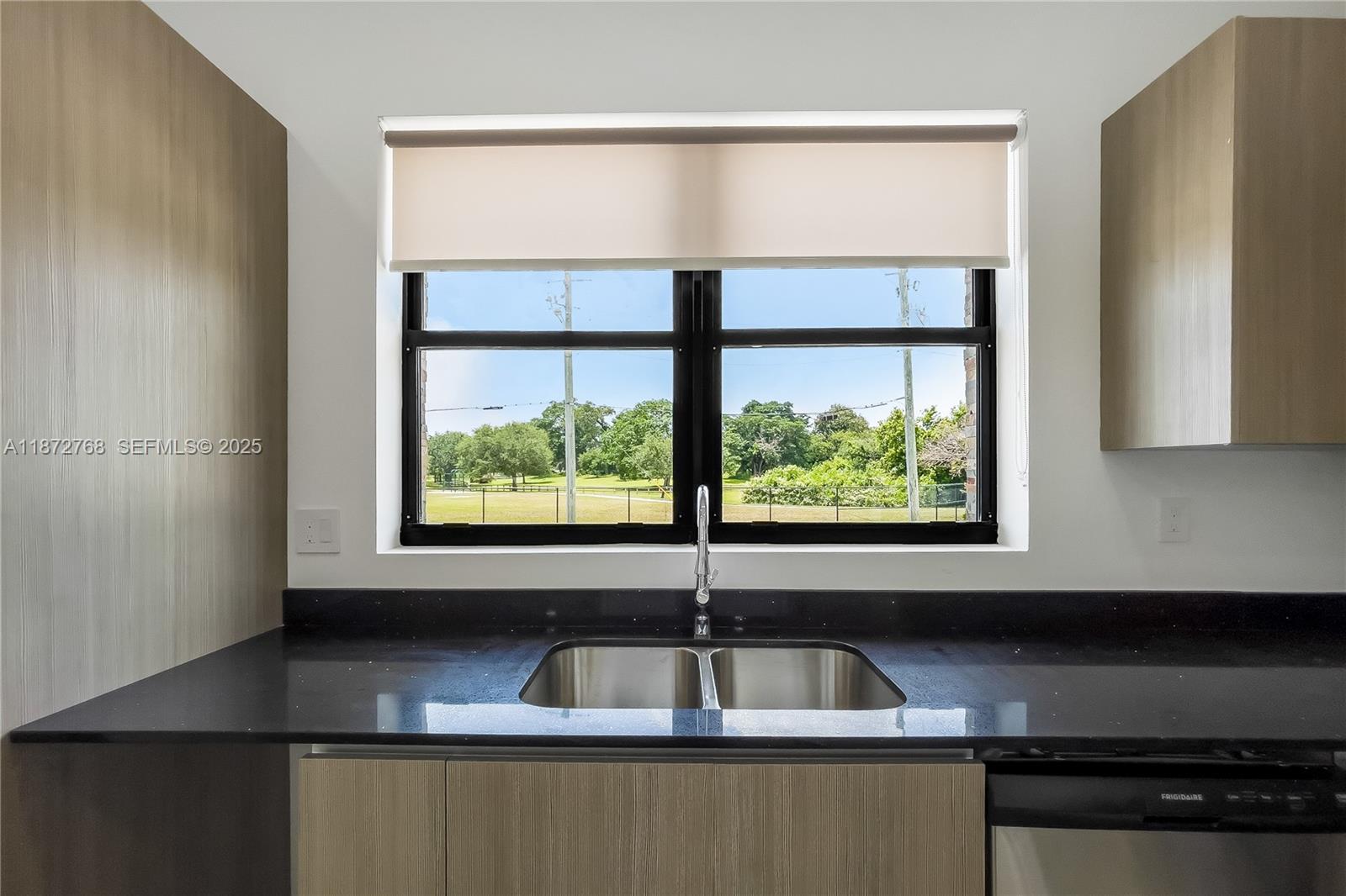 6159 Southwest 36th Court Miramar, FL 33023 - Photo 9 of 28 a kitchen with a sink and a window