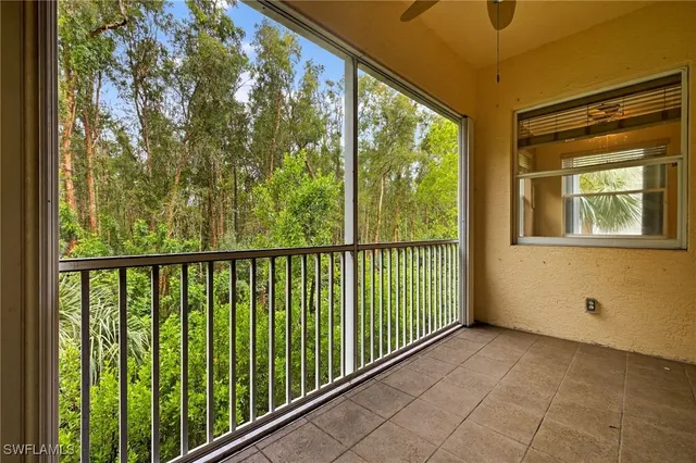 a view of a balcony with wooden floor
