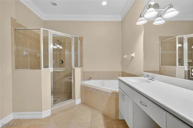 a bathroom with a sink a mirror and a shower