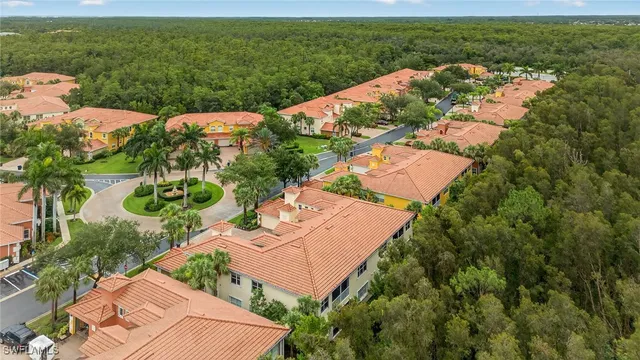an aerial view of residential houses with outdoor space and street view