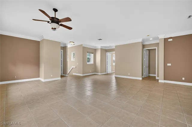 a view of a livingroom with a ceiling fan and window