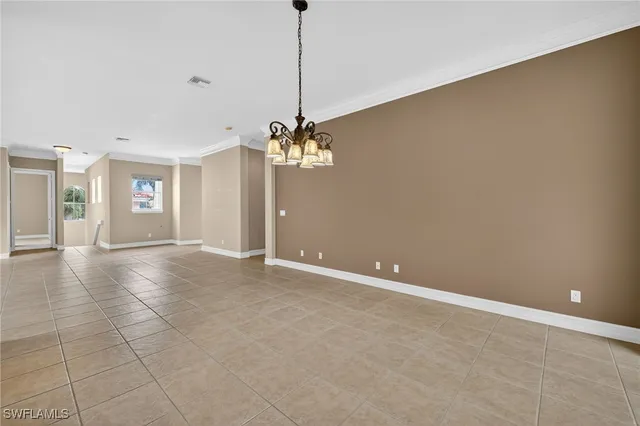 a view of a livingroom with a ceiling fan and window