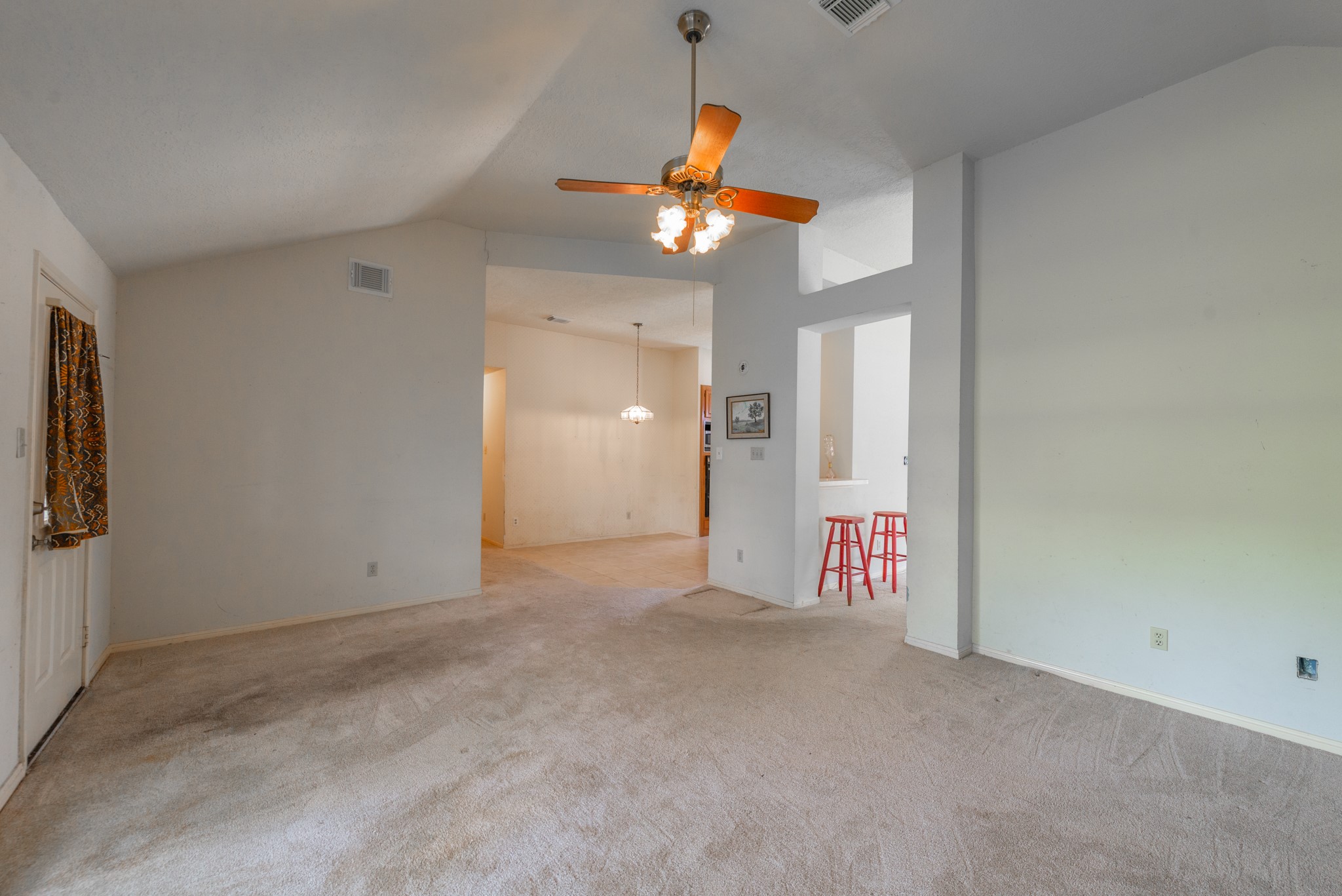 12203 Canterhurst Way Houston, TX 77065 - Photo 7 of 23 a view of a livingroom with a ceiling fan and window