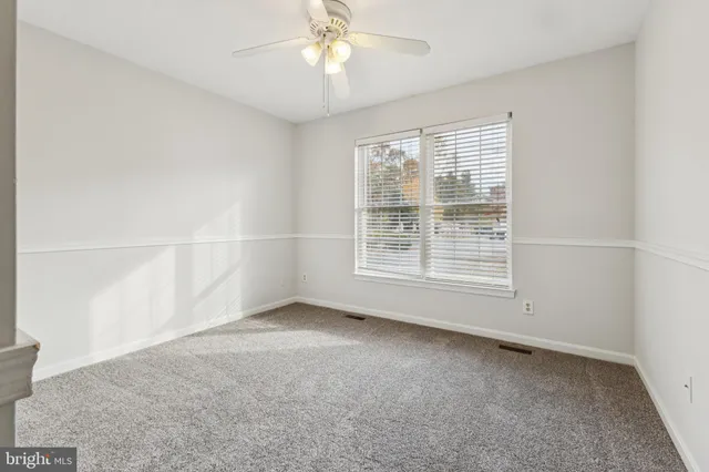 an empty room with a empty space and a window