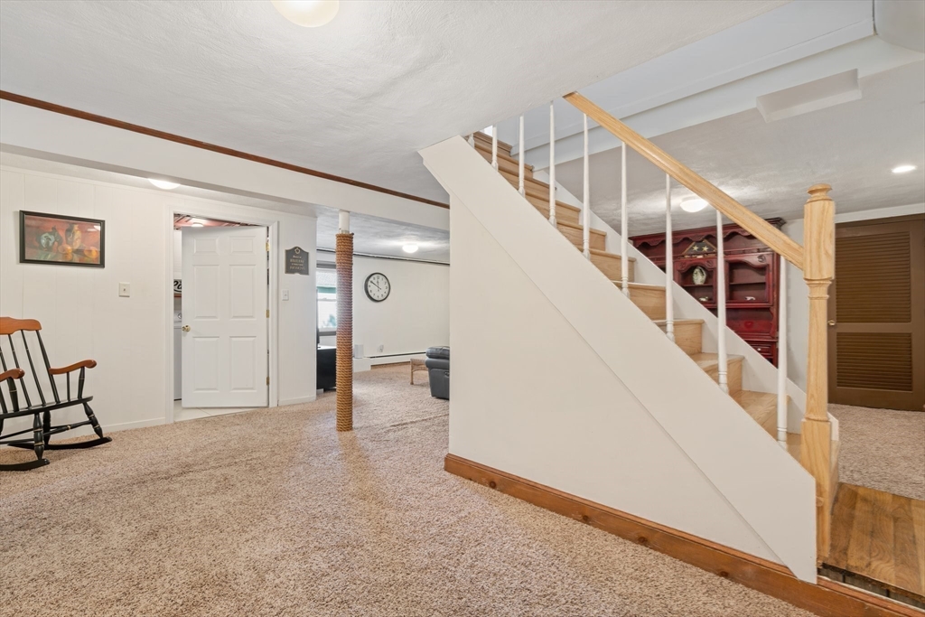 27 Jeffrey Road Arlington, MA 02474 - Photo 23 of 41 a view of a hallway with staircase