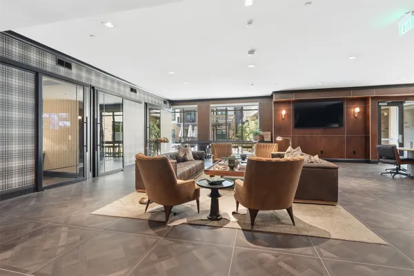 a view of a livingroom with wooden floor and a window