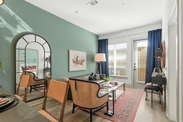 a view of a livingroom with furniture and a window