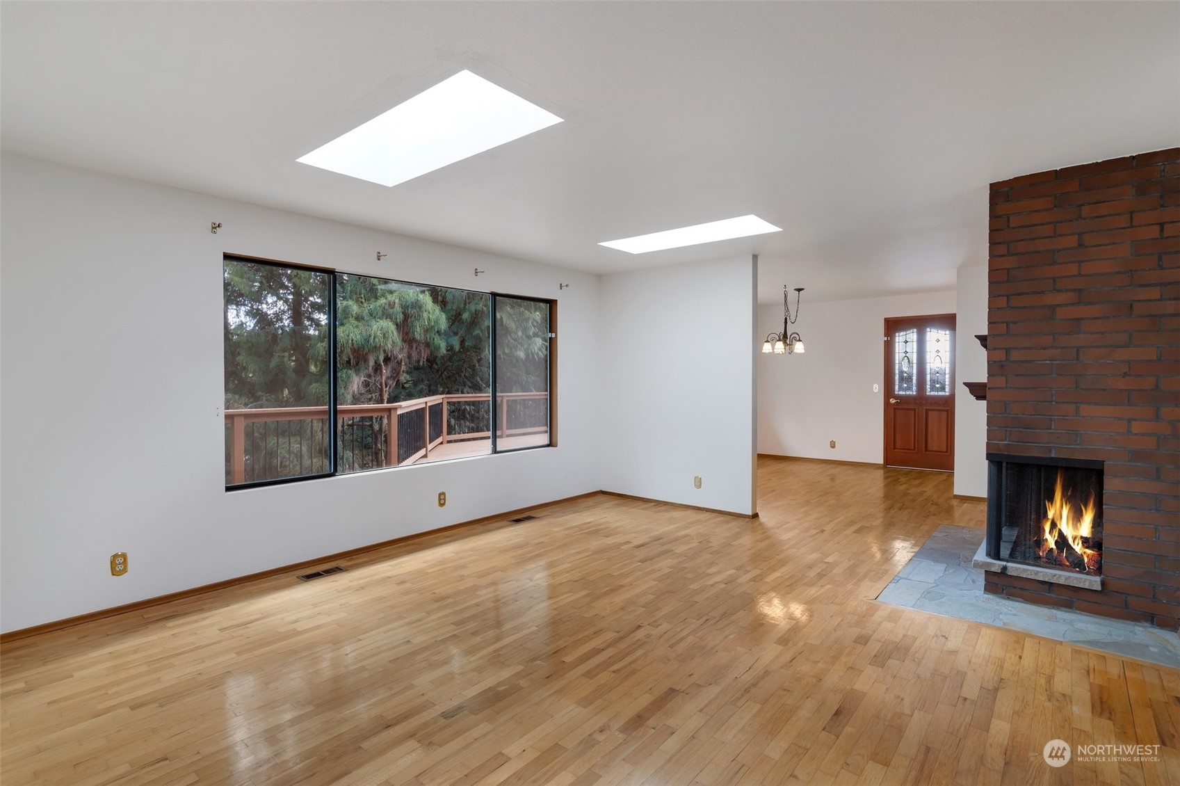 23331 19th Place West Bothell, WA 98021 - Photo 4 of 25 a view of an empty room with a fireplace and a window