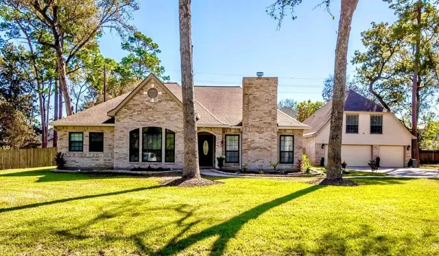 a front view of house with yard and swimming pool