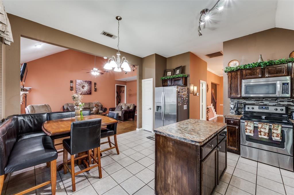 305 Ravenna Road Lake Dallas, TX 75065 - Photo 14 of 23 a view of a dining room with furniture