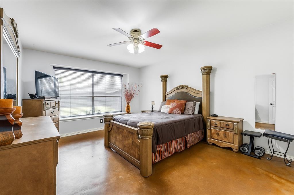 305 Ravenna Road Lake Dallas, TX 75065 - Photo 20 of 23 a bedroom with a bed and a large window