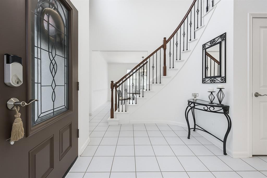 305 Ravenna Road Lake Dallas, TX 75065 - Photo 3 of 23 a view of an entryway with wooden floor