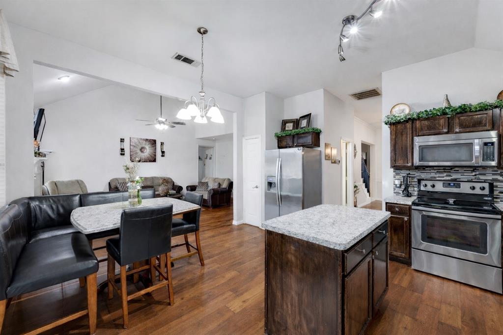 305 Ravenna Road Lake Dallas, TX 75065 - Photo 9 of 22 Ceramic tile shown removed and replaced with wood. Counter changed to show options to upgrade