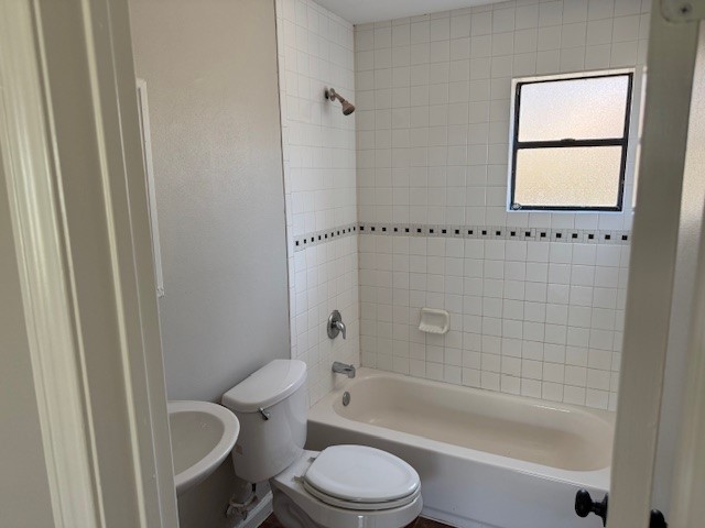 3620 Southmore Boulevard, Unit 11 Houston, TX 77004 - Photo 12 of 15 a bathroom with a toilet and a shower