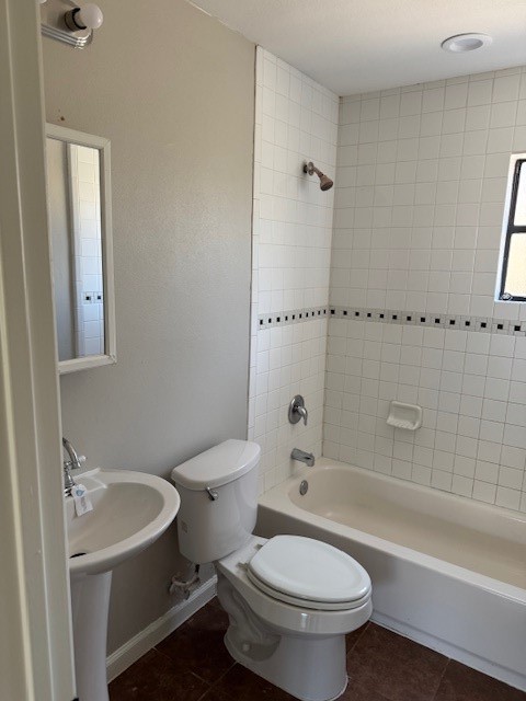 3620 Southmore Boulevard, Unit 11 Houston, TX 77004 - Photo 13 of 15 a white toilet sitting next to a bath tub