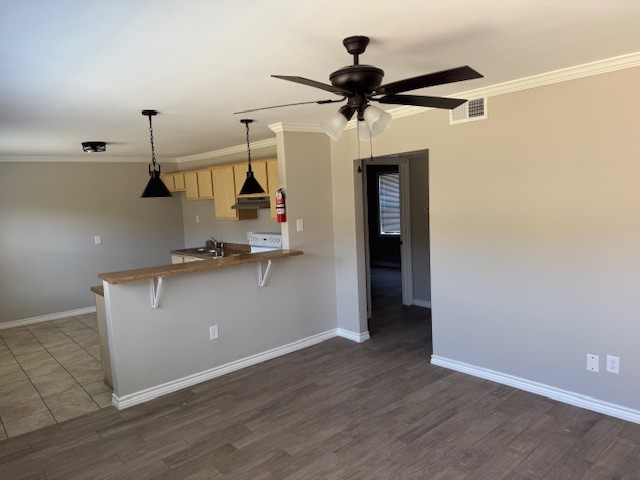 3620 Southmore Boulevard, Unit 11 Houston, TX 77004 - Photo 15 of 15 a view of a livingroom with wooden floor and a ceiling fan
