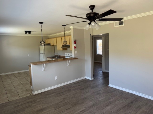3620 Southmore Boulevard, Unit 11 Houston, TX 77004 - Photo 4 of 15 a view of a room with wooden floor and a ceiling fan