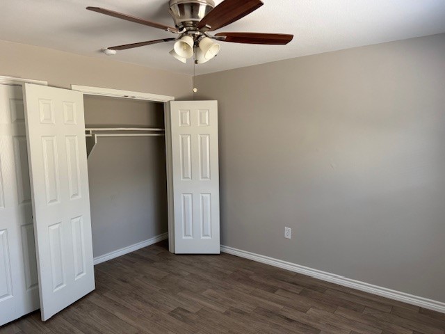 3620 Southmore Boulevard, Unit 11 Houston, TX 77004 - Photo 9 of 15 an empty room with wooden floor closet fan and windows