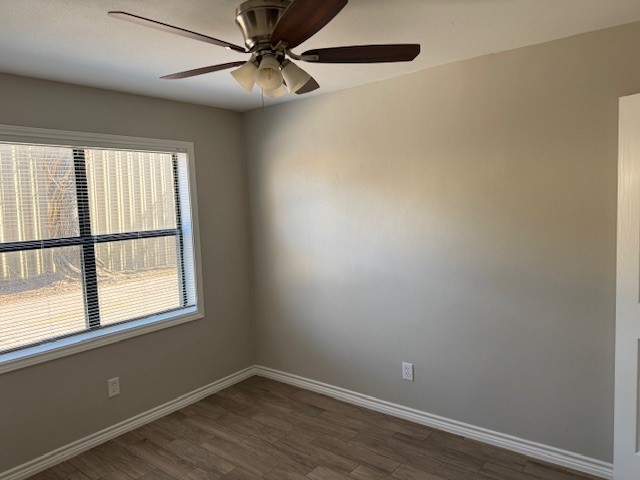 3620 Southmore Boulevard, Unit 11 Houston, TX 77004 - Photo 10 of 15 an empty room with wooden floor fan and windows