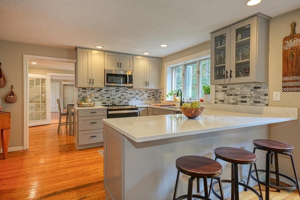 3 Pheasanthill Road Norfolk, MA 02056 - Photo 11 of 32 a kitchen with a sink cabinets and wooden floor