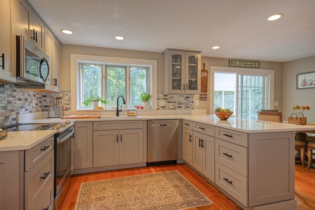 3 Pheasanthill Road Norfolk, MA 02056 - Photo 12 of 32 a kitchen with a sink stove and microwave