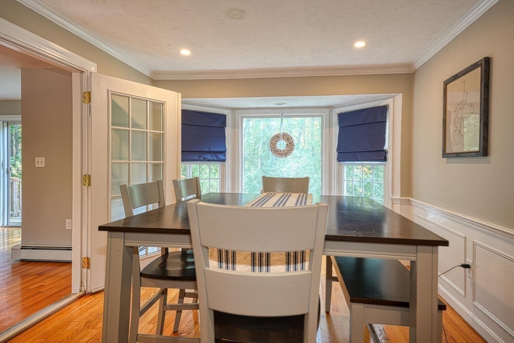 3 Pheasanthill Road Norfolk, MA 02056 - Photo 14 of 32 a view of a dining room with furniture and wooden floor