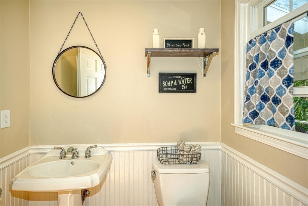 3 Pheasanthill Road Norfolk, MA 02056 - Photo 15 of 32 a bathroom with a sink a mirror and a toilet