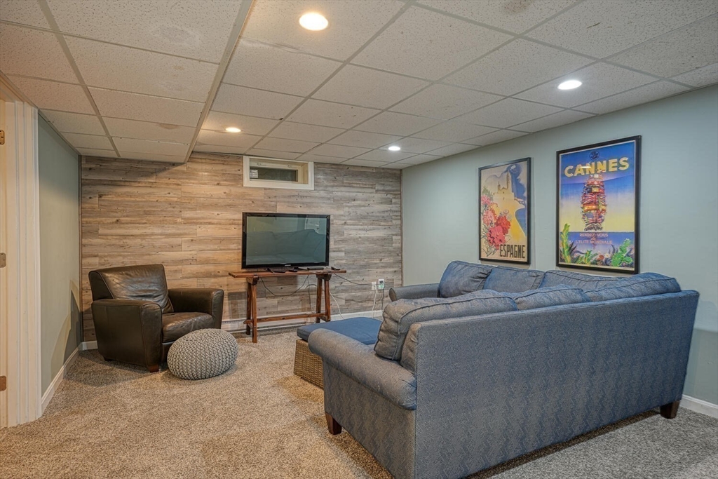 3 Pheasanthill Road Norfolk, MA 02056 - Photo 25 of 32 a living room with furniture and a flat screen tv