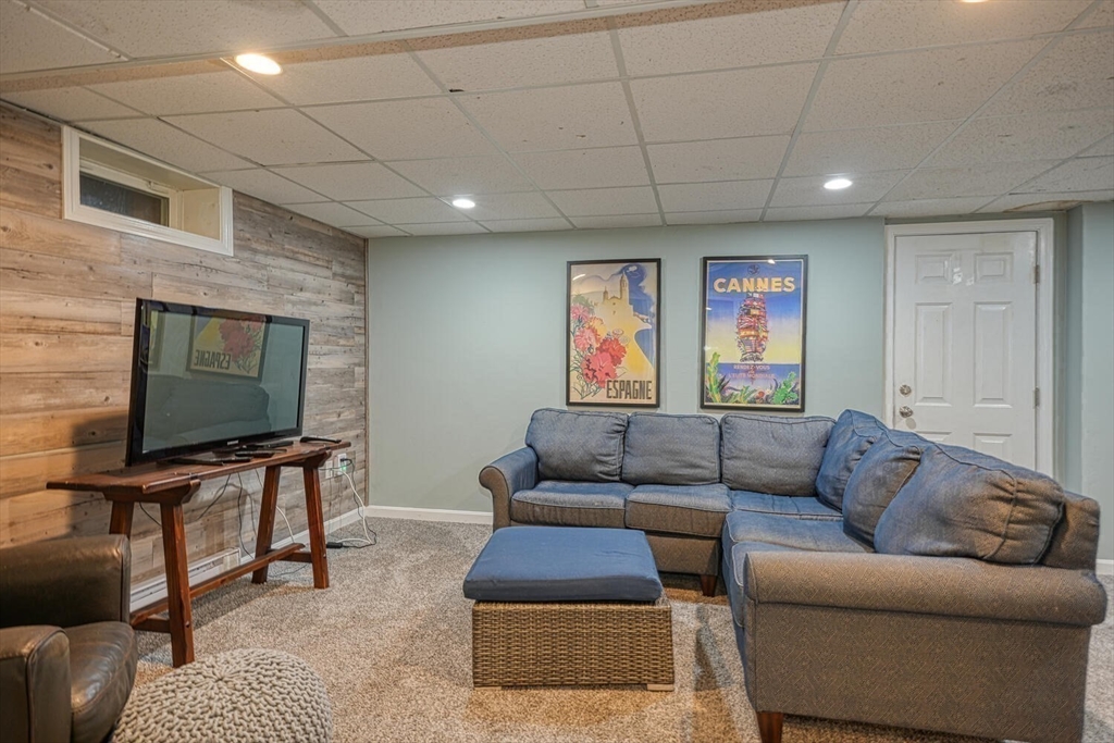3 Pheasanthill Road Norfolk, MA 02056 - Photo 26 of 32 a living room with furniture and a flat screen tv