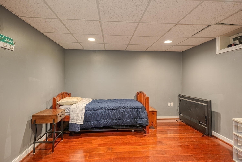 3 Pheasanthill Road Norfolk, MA 02056 - Photo 27 of 32 a living room with a furniture and a fireplace