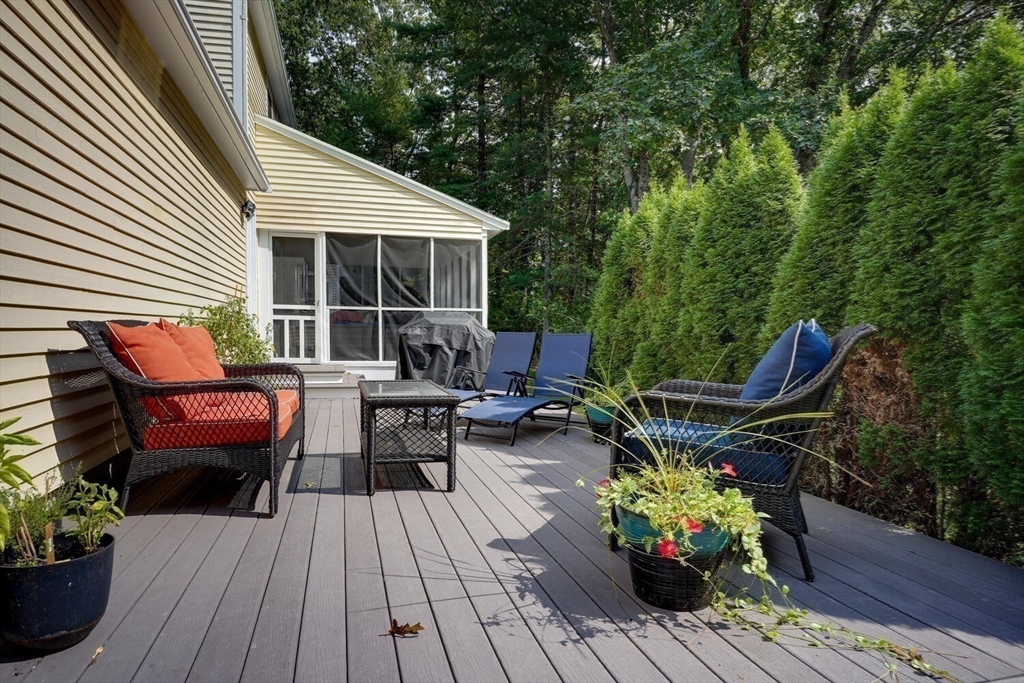 3 Pheasanthill Road Norfolk, MA 02056 - Photo 30 of 32 a backyard of a house with wooden floor yard and outdoor seating