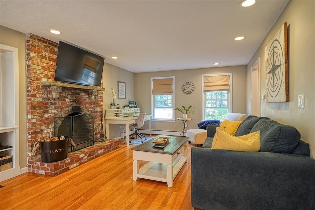 3 Pheasanthill Road Norfolk, MA 02056 - Photo 4 of 32 a living room with furniture and a flat screen tv
