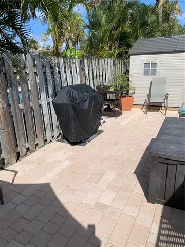 a view of backyard with a patio and outdoor seating