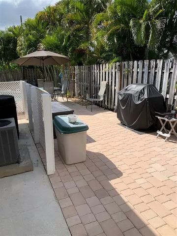 a view of outdoor space with patio furniture and garden