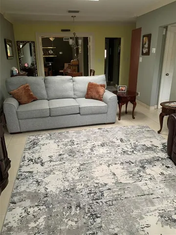 a living room with furniture and a couch