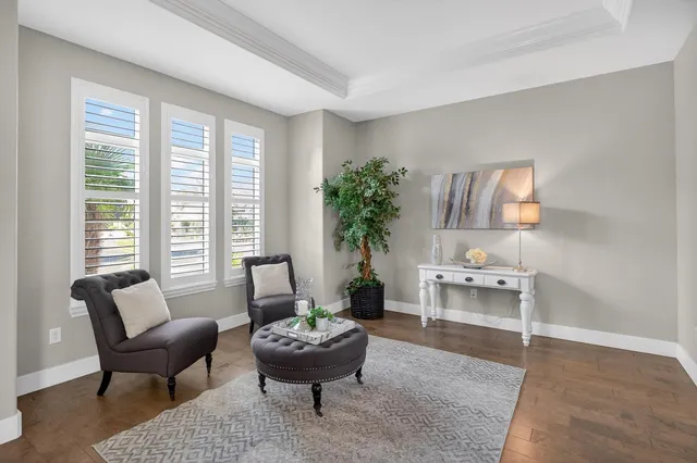 a kitchen with stainless steel appliances granite countertop a sink a stove and cabinets