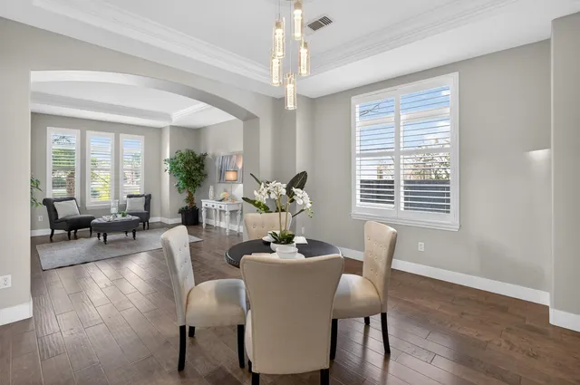 a living room with furniture kitchen and a window