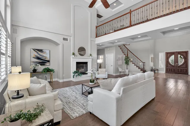 a kitchen with granite countertop white cabinets stainless steel appliances and a sink