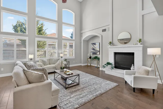 a kitchen with white cabinets and sink