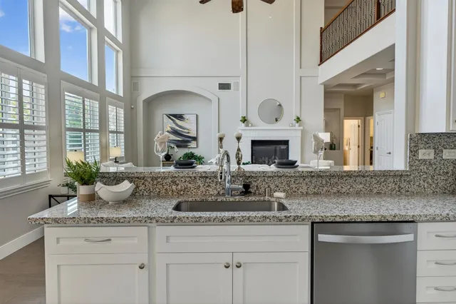 a view of a hallway with wooden floor and stairs