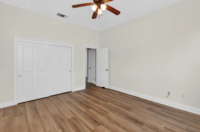 a bathroom with bathtub and window