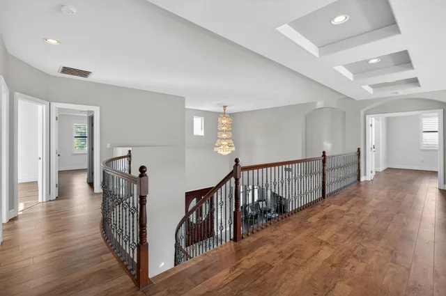 a bathroom with a granite countertop sink mirror vanity and toilet
