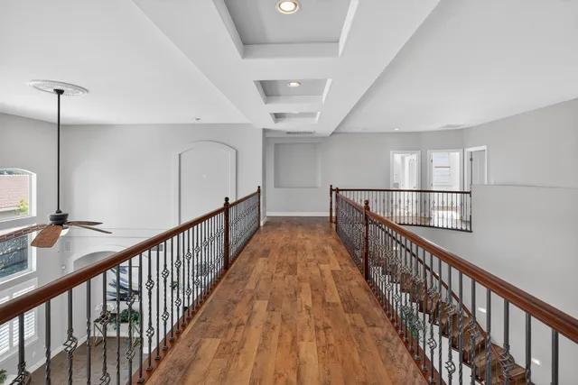 a bathroom with a granite countertop sink a mirror and a shower