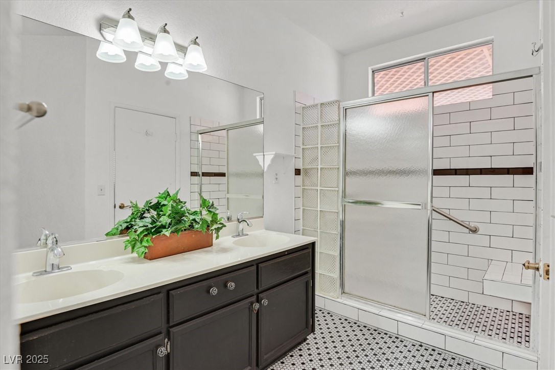 731 Rising Star Drive Henderson, NV 89014 - Photo 15 of 25 Full bath featuring a shower stall and double vanity
