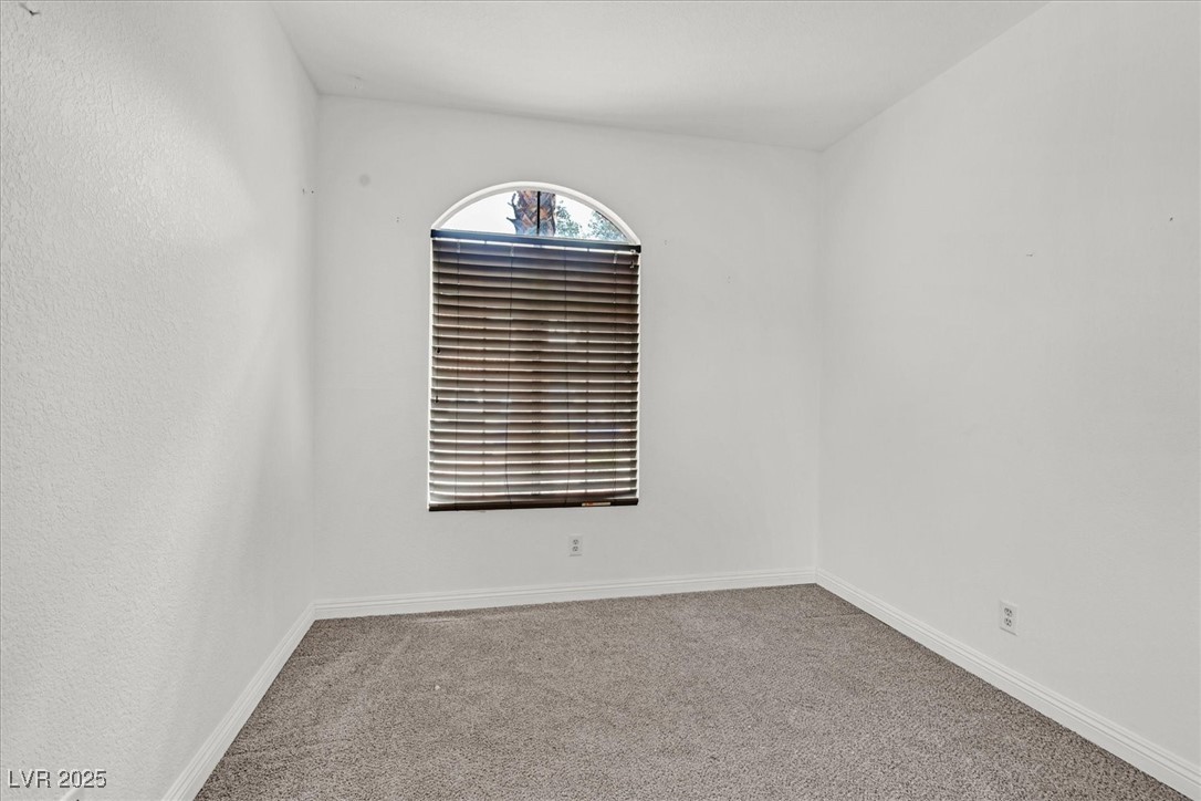 731 Rising Star Drive Henderson, NV 89014 - Photo 19 of 25 Empty room featuring carpet flooring and baseboards