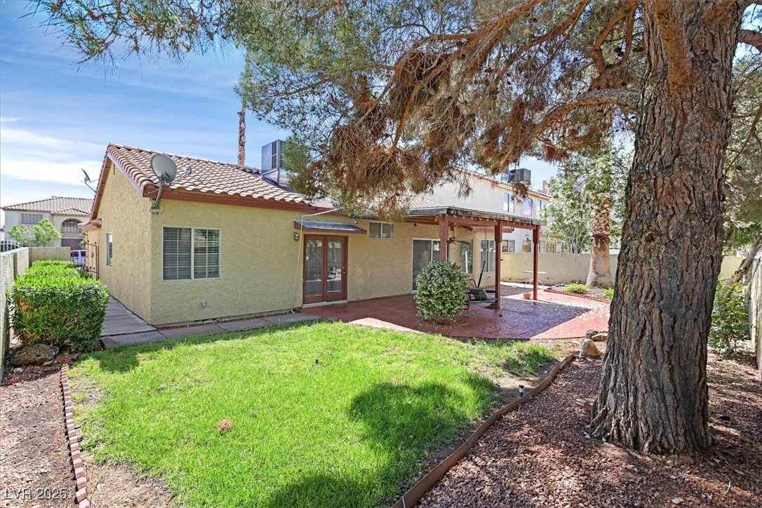 731 Rising Star Drive Henderson, NV 89014 - Photo 23 of 25 Back of house featuring french doors, a tile roof, stucco siding, and a patio area
