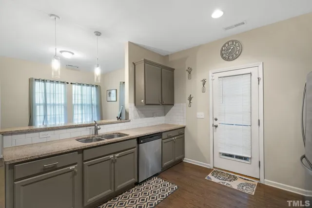 a bathroom with a sink a mirror and a shower