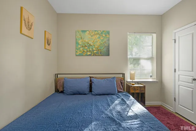 a room with window and wall painting