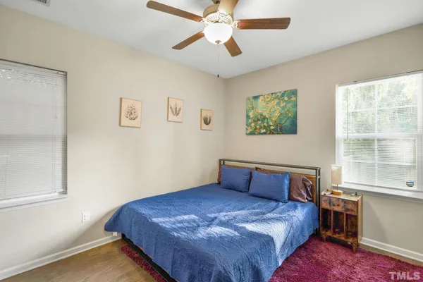 a bedroom with a bed and window